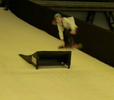 London Ski and Snowboard show, a snowboarder jumping